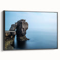 Framed canvas wall art showcasing a stunning landscape of cliffs, presented in a sleek black frame, perfect for adding elegance to any room decor.