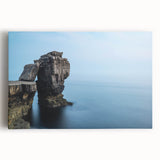 Stretched canvas artwork depicting a vibrant landscape of rugged cliffs under a clear blue sky, showcasing natural beauty and serene ambiance, perfect for home decor.