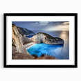 Framed black wall art showcasing a stunning landscape of cliffs, featuring vibrant colors and intricate details, perfect for modern home decor.