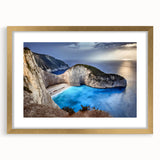 Framed landscape wall art collection depicting dramatic cliffs and serene ocean views, featuring a gold frame with a mat for an elegant finish. Perfect for home decor.