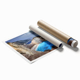 Rolled print showcasing a vibrant landscape of cliffs and mountains, featuring rich colors and intricate details, perfect for home decor or wall art collection.