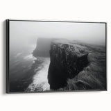 Framed canvas wall art depicting a vibrant landscape with cliffs and a sunset, featuring rich colors of orange and blue, perfect for modern home decor.