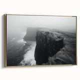 Framed canvas wall art featuring a scenic landscape with rocky cliffs and vibrant colors, set against a gold frame, enhancing interior decor aesthetics.