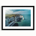 Framed wall art featuring a scenic landscape of cliffs, presented with a black mat and sleek frame, ideal for modern home decor and interior design.