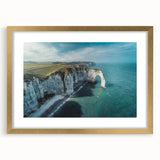 Framed wall art featuring a stunning landscape of cliffs, enhanced with a gold mat for a sophisticated touch, ideal for modern home décor.
