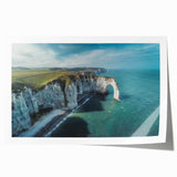 Rolled print showcasing a stunning landscape of cliffs at sunset, featuring vibrant hues of orange and purple, perfect for enhancing home decor with natural beauty.