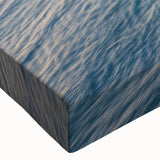 Close-up of a stretched canvas artwork showcasing a dramatic landscape of rugged cliffs and vibrant blue skies, perfect for contemporary home decor and nature enthusiasts. This wall art collection adds a touch of elegance and tranquility to any living space.