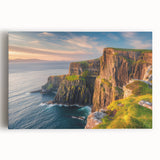 Stretched canvas wall art showcasing a vibrant landscape of cliffs at sunset, featuring rich oranges and purples, ideal for modern home decor.