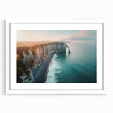 Framed wall art featuring a stunning landscape of dramatic cliffs, with a white matting and sleek frame, perfect for enhancing modern home decor.