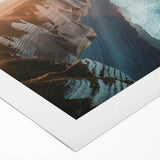 Rolled canvas artwork showcasing a vibrant landscape of cliffs and ocean waves, ideal for home decor. The design captures nature's beauty with rich colors and details.