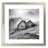 Framed wall art depicting a serene countryside landscape, featuring lush green fields and a vibrant sky, elegantly presented in a silver frame with a mat for a modern touch.