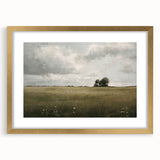 Framed wall art showcasing a scenic countryside landscape with vibrant colors, elegantly displayed in a gold frame with a white mat, ideal for home decor.