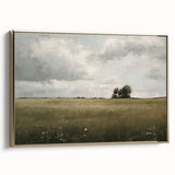 Framed canvas wall art showcasing a serene countryside landscape, featuring vibrant green fields and a golden sunset, perfect for home decor.