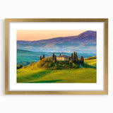 Framed wall art featuring a serene countryside landscape with vibrant green fields and a golden frame, ideal for enhancing home decor in living spaces.