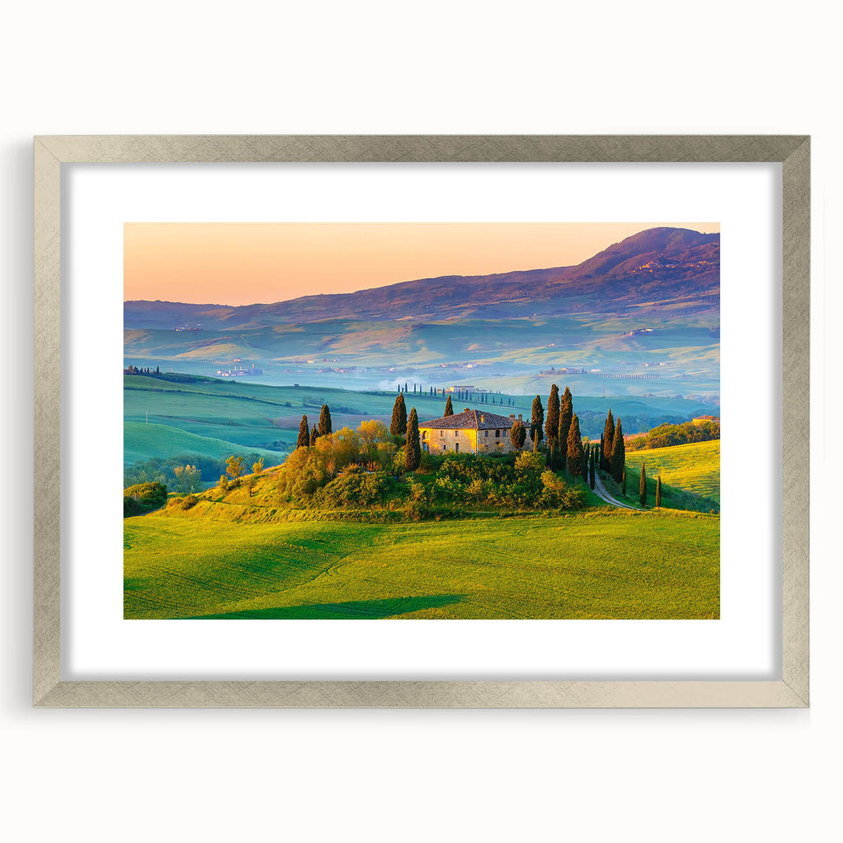 Framed wall art showcasing a serene countryside landscape design with a silver mat, perfect for enhancing home decor and adding a touch of elegance. The artwork features lush green fields and a clear blue sky, ideal for nature enthusiasts and interior design.