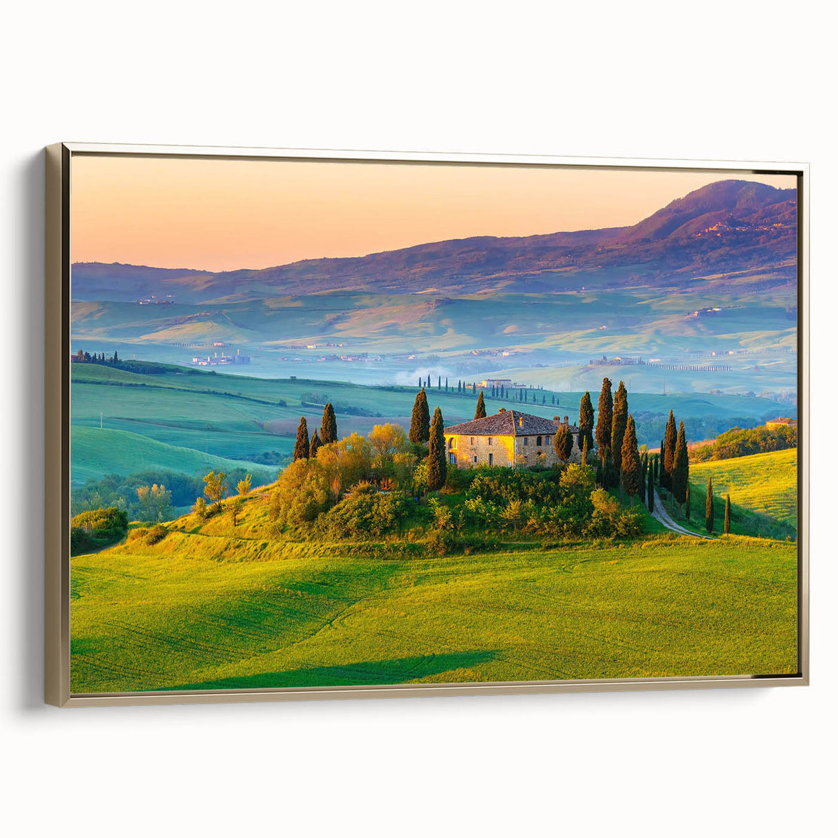 Framed canvas wall art showcasing a serene countryside landscape with vibrant green fields and a golden sunset, ideal for home decor or office ambiance.