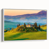 Framed canvas wall art showcasing a serene countryside landscape design, with lush green fields and a blue sky, presented in a sleek white frame, perfect for home decor.