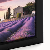 Framed canvas wall art showcasing a serene countryside landscape with vibrant greens and soft blues, designed to enhance home decor and create a tranquil atmosphere.