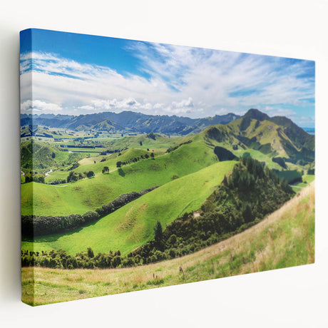 Stretched canvas wall art showcasing a serene countryside landscape with vibrant greens and blues, perfect for home decor or office settings.