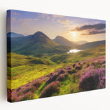 Stretched canvas wall art showcasing a serene countryside landscape with rolling green hills and a vibrant sunset, adding a tranquil touch to home decor.