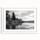 Framed wall art collection showcasing a serene countryside landscape with vibrant green fields and a clear sky, elegantly displayed with a white mat for added contrast and sophistication.