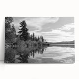 Stretched canvas artwork depicting a serene countryside landscape with rolling hills and vibrant greenery, perfect for home decor in a rustic theme.