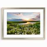 Framed wall art showcasing a serene countryside landscape, featuring lush green fields and a vibrant blue sky, presented in a silver frame with a mat. Ideal for home decor.