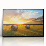 Framed wall art collection showcasing a serene countryside landscape, featuring vibrant green fields and a clear blue sky, presented in a sleek black frame.