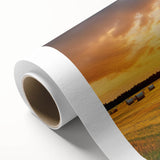 Rolled canvas artwork showcasing a serene countryside landscape with lush green fields, a vibrant blue sky, and distant hills, ideal for home decor.