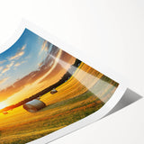 Vibrant rolled print of a serene countryside landscape, showcasing lush green fields and a clear blue sky, ideal for home decor or art collection.