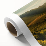 Rolled canvas artwork showcasing a serene countryside landscape with vibrant green hills and a clear blue sky, perfect for home decor. The design captures the tranquility of nature, making it an ideal centerpiece for any room.