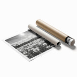 Rolled print of a scenic countryside landscape featuring vibrant green hills, a serene blue sky, and fluffy white clouds, ideal for home decor.