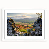 Framed wall art featuring a serene countryside landscape in soft pastel colors, complete with a white mat and sleek frame, ideal for home decor.