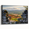 Framed canvas wall art displaying a serene countryside landscape design, featuring vibrant green fields and a clear blue sky, highlighted by a sleek black frame. Perfect for home décor enthusiasts seeking nature-inspired artwork.
