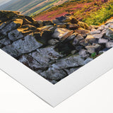 Rolled canvas artwork showcasing a serene countryside landscape with vibrant colors, ideal for home decor. Packaged securely in a cardboard tube for protection.