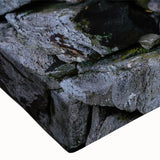 Close-up of a vibrant stretched canvas wall art piece showcasing a serene countryside landscape with lush greenery and rolling hills, perfect for home decor.