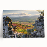 Stretched canvas artwork showcasing a serene countryside landscape with vibrant green fields and a clear blue sky, perfect for home décor in a rustic setting.