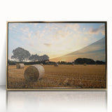 Framed acrylic wall art depicting a serene countryside landscape with vibrant green fields and a golden sunset, enhancing home decor with a touch of nature.