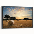 Framed canvas wall art depicting a serene countryside landscape with vibrant greens and blues, featuring a black frame that enhances its artistic appeal. Perfect for home decor enthusiasts seeking a touch of nature-inspired elegance.