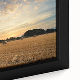 Close-up of a framed canvas print showcasing a vibrant countryside landscape design, featuring lush green fields, rolling hills, and a serene sky, perfect for home decor.