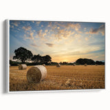Framed canvas wall art depicting a serene countryside landscape, featuring rolling hills, lush greenery, and a vibrant blue sky. The artwork is elegantly displayed in a white frame, ideal for home decor.