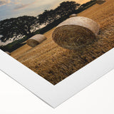 Rolled canvas artwork showcasing a picturesque countryside landscape design, featuring vibrant greens and soft blues, ideal for home decor and aesthetic enhancement.