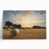 Stretched canvas artwork showcasing a serene countryside landscape, featuring lush green fields and soft blue skies, ideal for home decor in rustic or modern settings.