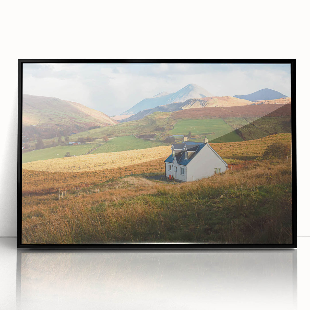 Framed acrylic wall art showcasing a serene countryside landscape in soft hues of green and blue, featuring a contemporary black frame, ideal for home decor.