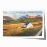 Rolled print showcasing a serene countryside landscape design with vibrant colors, ideal for home decor, shipped securely in a protective cardboard tube.