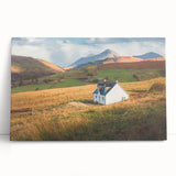 Vibrant stretched canvas depicting a serene countryside landscape with rolling hills and a clear blue sky, perfect for enhancing home decor with nature-inspired art.