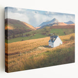 Stretched canvas wall art displaying a serene countryside landscape design, featuring vibrant green fields and a blue sky, ideal for home decor.