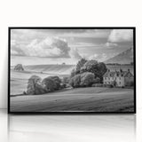 Framed acrylic wall art showcasing a serene countryside landscape with vibrant green fields and a clear blue sky, designed to enhance home decor aesthetics.
