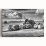 Stretched canvas artwork depicting a serene countryside landscape with vibrant green fields, rolling hills, and a clear blue sky, perfect for home decor.