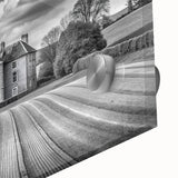 Close-up of a vibrant acrylic glass wall art piece showcasing a serene countryside landscape with lush greenery, rolling hills, and a clear blue sky, perfect for home decor.